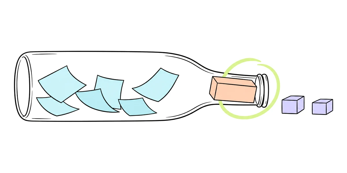 A bottle on its side holds paper sheets that float freely, but a brick blocks its narrow neck, and only two small boxes have come out.